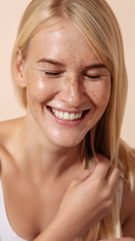 close up of womans face with beautiful skin